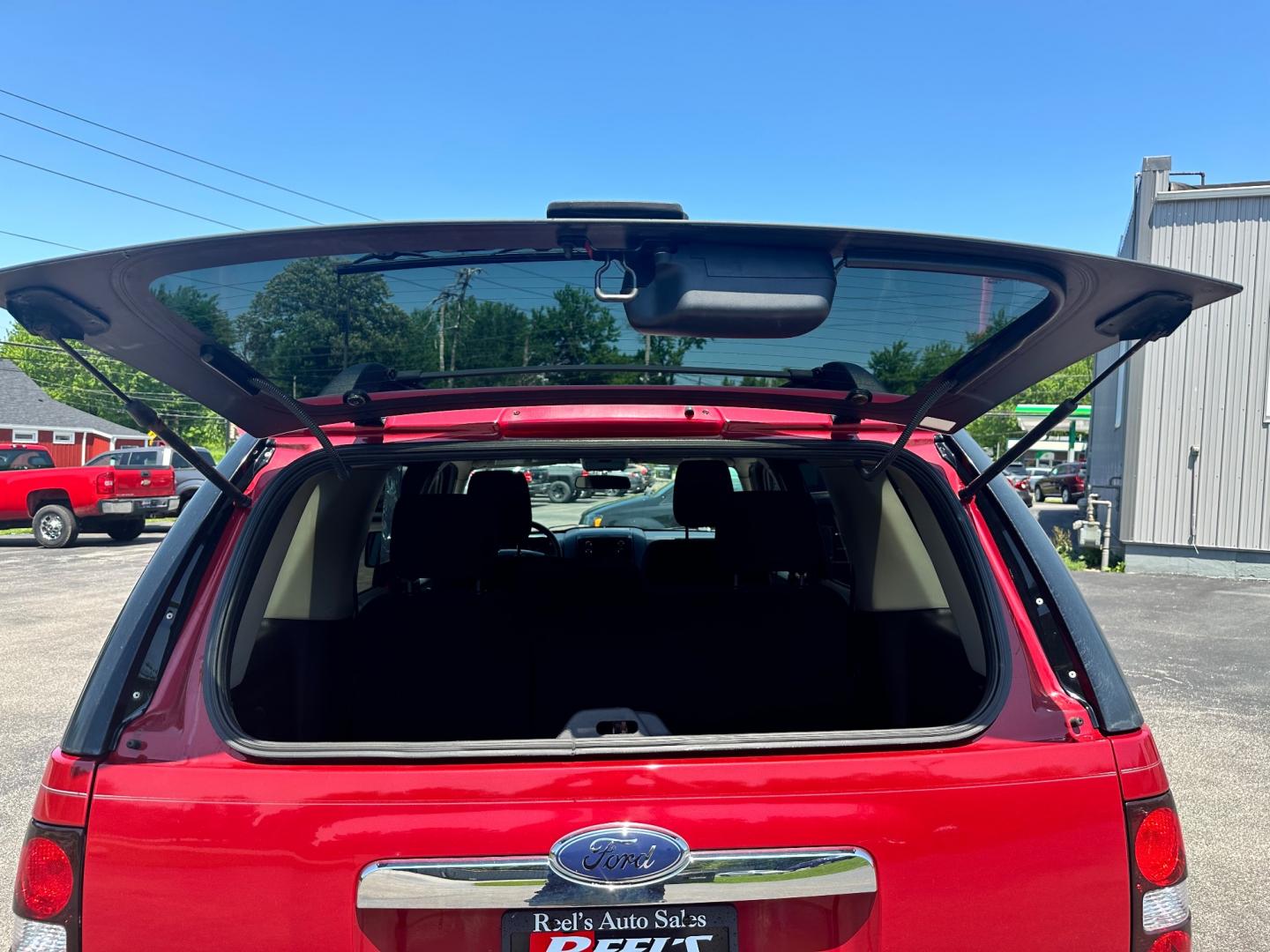 2009 Red /black Ford Explorer XLT (1FMEU73E89U) with an 4.0L V6 engine, 5-Speed Automatic transmission, located at 11115 Chardon Rd. , Chardon, OH, 44024, (440) 214-9705, 41.580246, -81.241943 - This 2009 Ford Explorer is a reliable and capable SUV, offering a 4.0L V6 engine paired with a 5-speed automatic transmission and full-time 4WD system. With a 3,500-pound towing capacity, it's suitable for moderate hauling needs. Additionally, the power driver's seat provides comfort and convenience - Photo#34